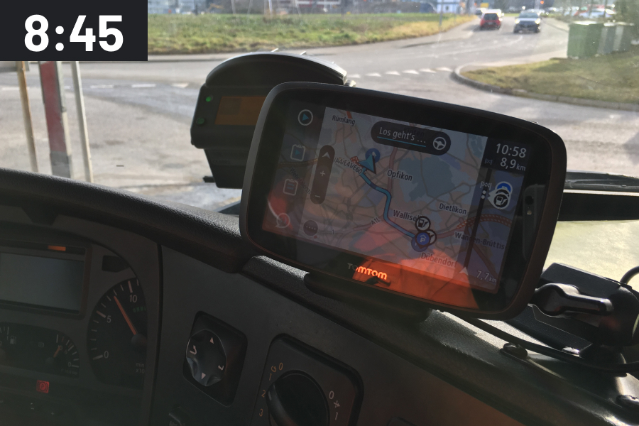 Truck navigation system on the windshield with time stamp 8:45 a.m.