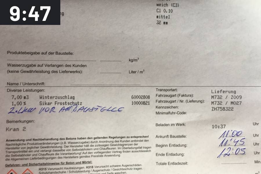 Photo of a delivery note for a concrete delivery with handwritten times and a time stamp of 9:47 a.m.
